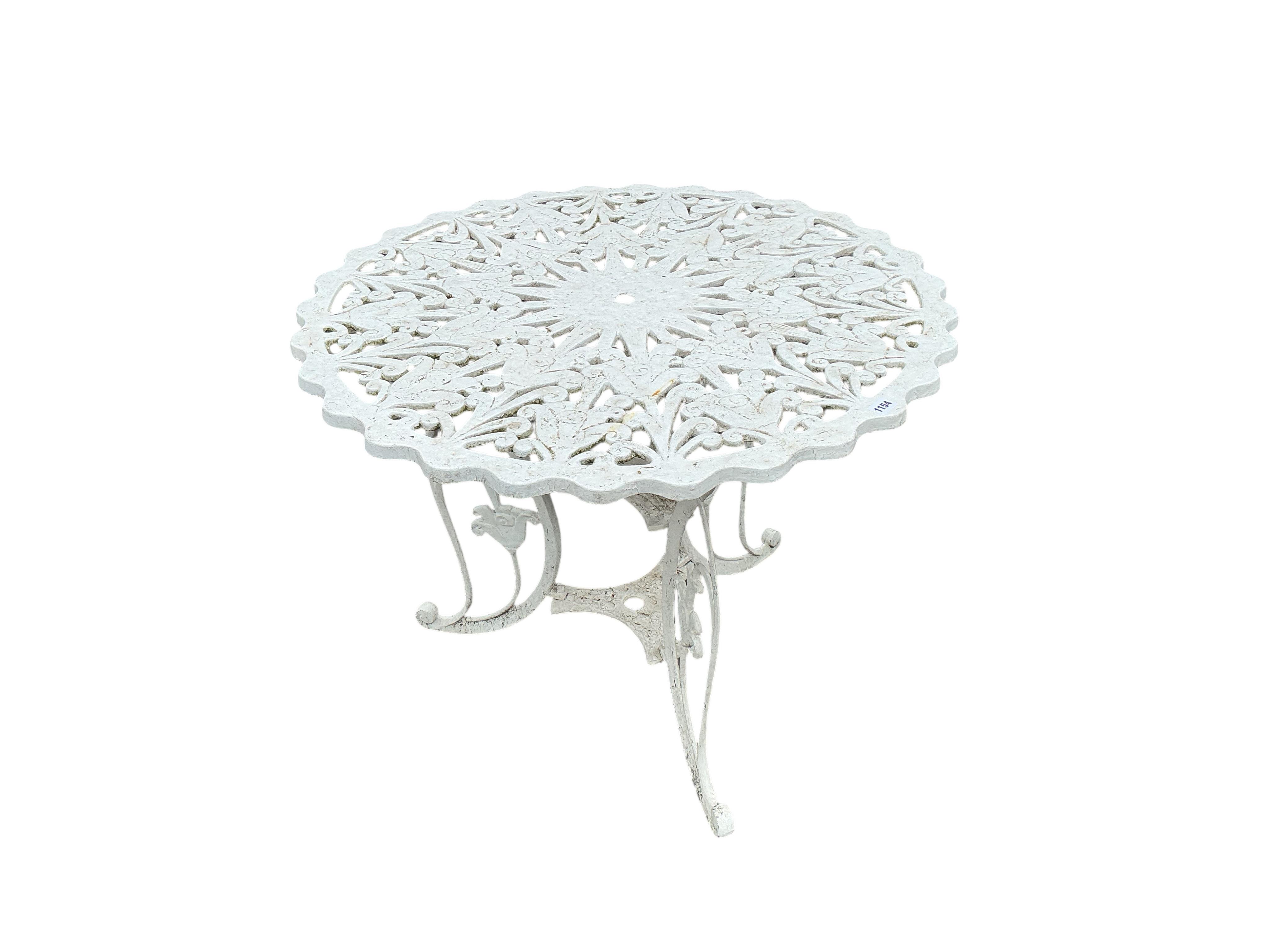 A Victorian style circular aluminium garden table, diameter 89cm, height 70cm and six chairs